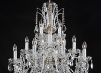 The upper part of the chandelier with rope glass scrolls