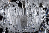 Detail of the large lower bowl of the chandelier covering the metal bowl of matte silver brass