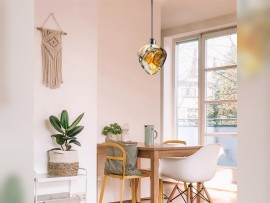 Chandelier with amber-smoky glass over the dining table