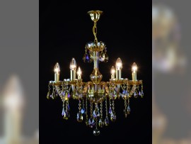 6-arm chandelier made of plated crystal in the shade of amber lit