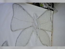 Detail of artistic butterfly - stainless steel construction with crystal stones and glass butterfly body