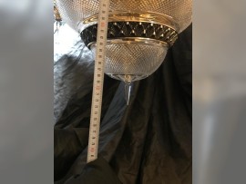 The lower part of the chandelier with a crystal tip