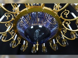 The lower part of the chandelier with blue glass