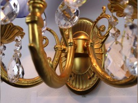 Detail of the cast brass metal arms of the wall lamp