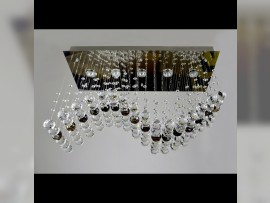 Smaller wavy chandelier with a strip of crystal balls in coffee color (metallized crystal - brown)