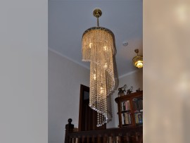 small spiral chandelier with hanging on a rod