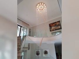 View of the entire spiral chandelier (18 bulbs, 120 x 270 cm) from the ground floor