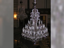 Detail of an extinguished silver chandelier of Maria Theresa 48 light bulbs