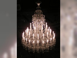 A large Terezin chandelier is lit.