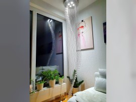 Spiral crystal chandelier in the interior of the bedroom 1