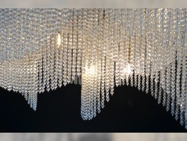 Detail of glass beads and metal of a modern light fixture