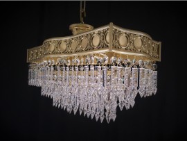 Detail of the rounded wall of the rectangular frame of the chandelier