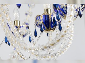 Detail of twisted glass arms and sapphire blue glass cups