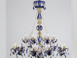 The upper half of a luxurious blue chandelier.