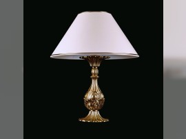 Massive table lamp with a textile shade made of brass castings.