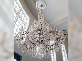 The 65 large cats brass chandelier in interior