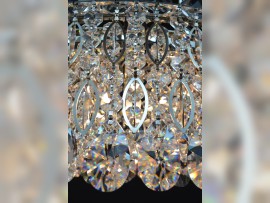 Detail of the classic design of the ring chandelier - clear crystal, silver metal