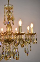 Detail of the light bowls of the colored chandelier lit