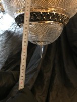 The lower part of the chandelier with a crystal tip