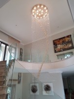 View of the entire spiral chandelier (18 bulbs, 120 x 270 cm) from the ground floor