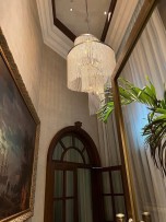 Spiral chandelier made of crystal pearls in the Interior of the entrance